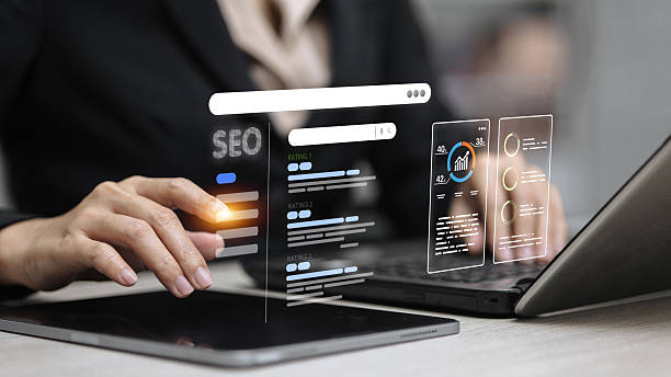 Top 5 Reasons Why Entrepreneurs Need A Good Website for Their Business 2 Business user working on a laptop with a virtual SEO dashboard displaying website traffic insights, graphs, and ranking stats.